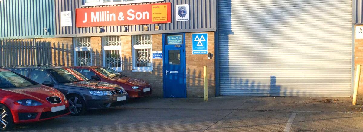 Front of the J Millin & Son garage with the MOT testing station sign
